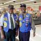 Retirees John H. Stephen, 78, left, and Louis Davis, 79, seen here on Friday afternoon, Oct. 27, 2000, work as greeters at the Wal-Mart in Tampa, Florida